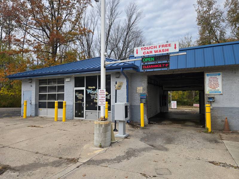 Touch Free Car Wash bay entrance with signage